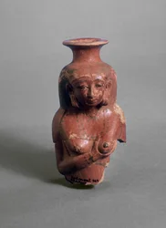 Antropomorfe vaas die een vrouw afbeeldt die borstvoeding geeft, mogelijk de godin Isis (geschilderd aardewerk)